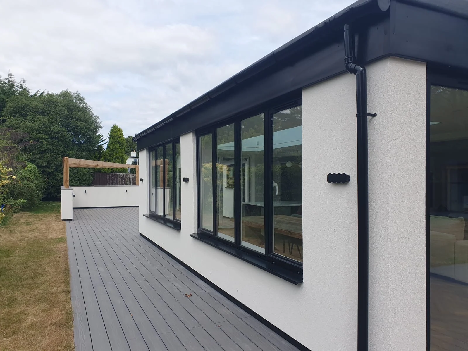 Rendered building and decking from Hunter Construction’s project gallery